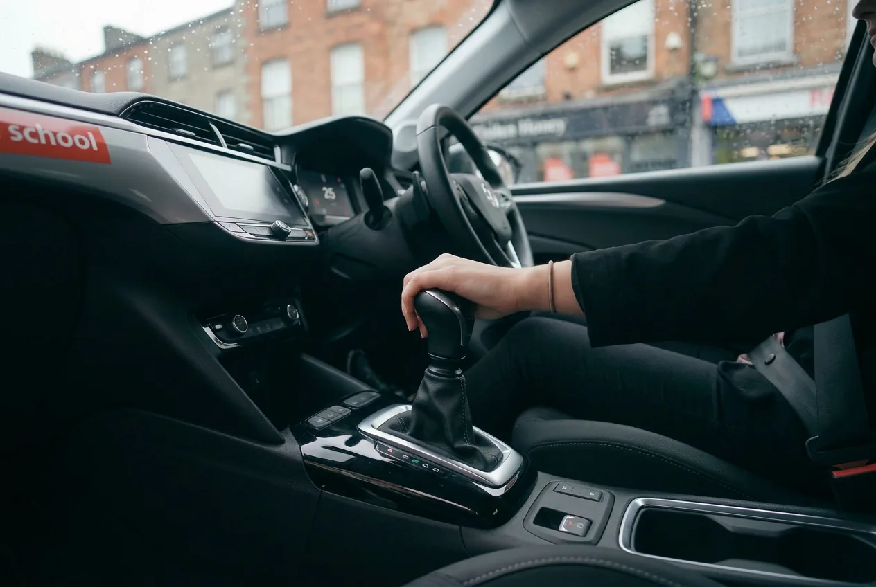 A learner's hand on the automatic gear selector of a learner car