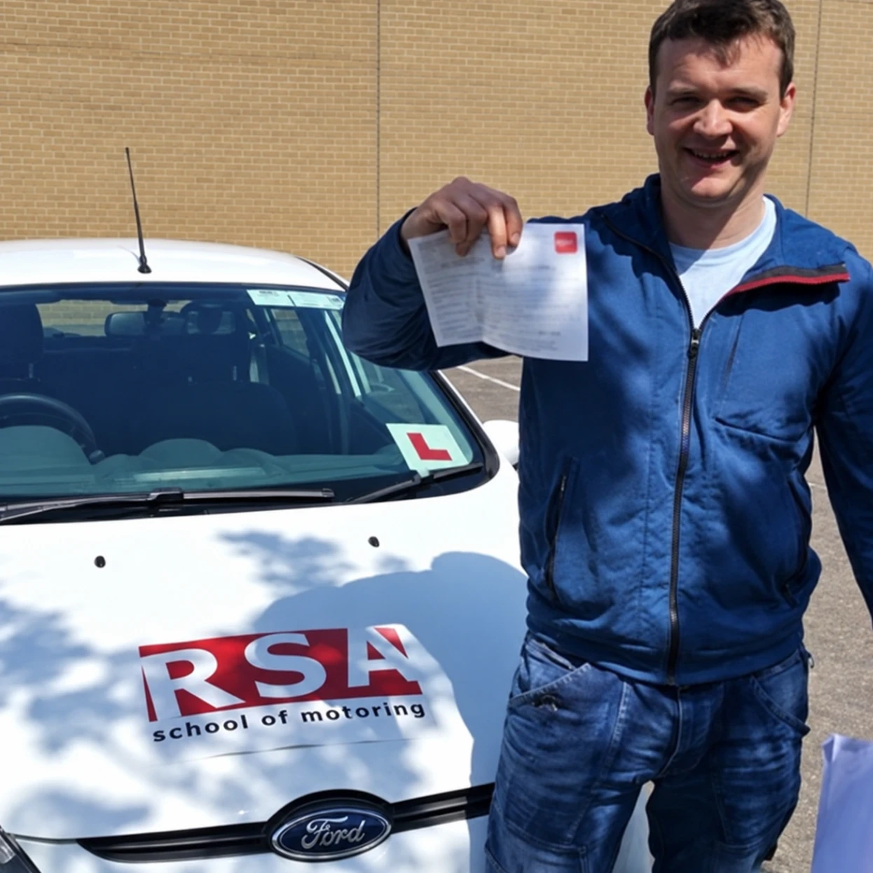 A learner celebrating passing the driving test in Tallaght