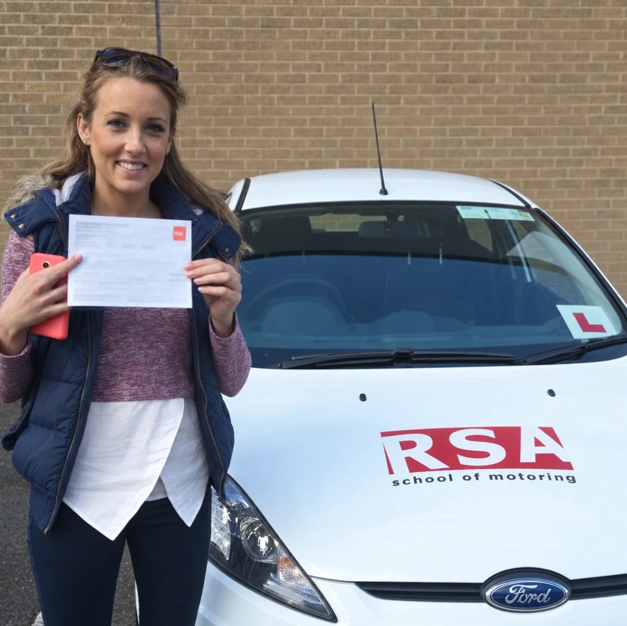 A learner celebrating passing the driving test in Tallaght