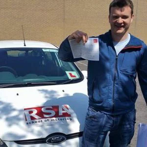 A learner celebrating passing the driving test in Tallaght