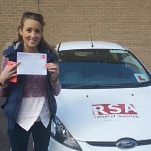 A learner celebrating passing the driving test in Tallaght